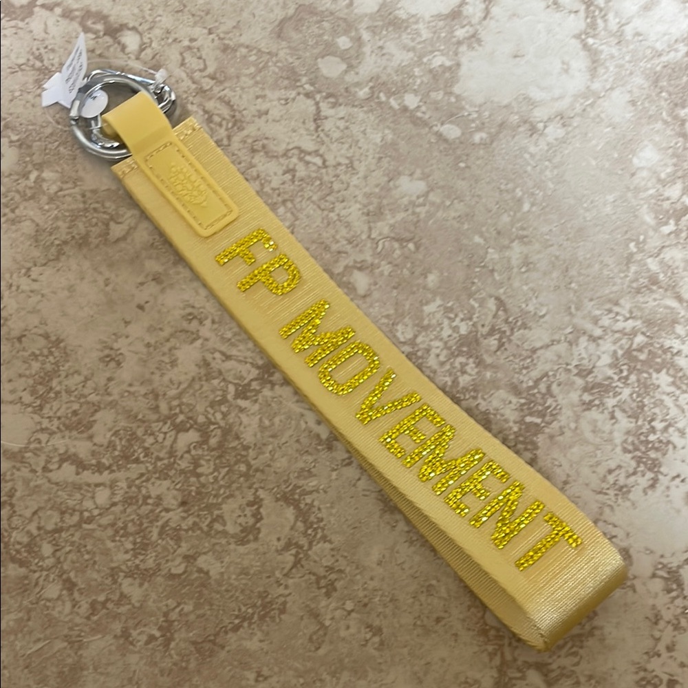 Yellow Free People Movement rhinestone keychain